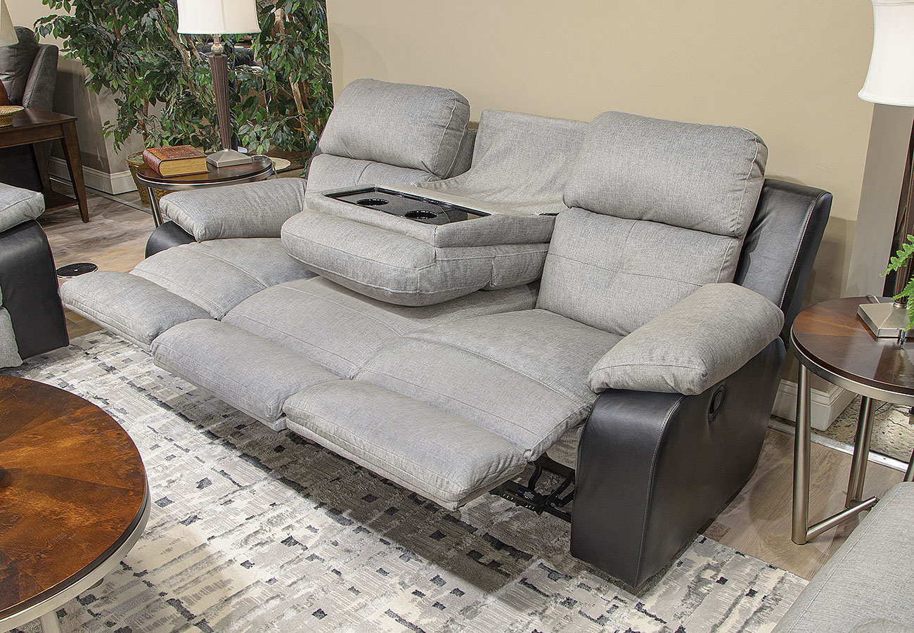 Reclining sofa with store drop down table
