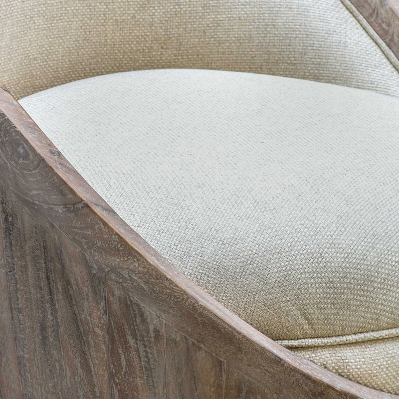 Close-up of the curved back and seat cushion of the accent chair.